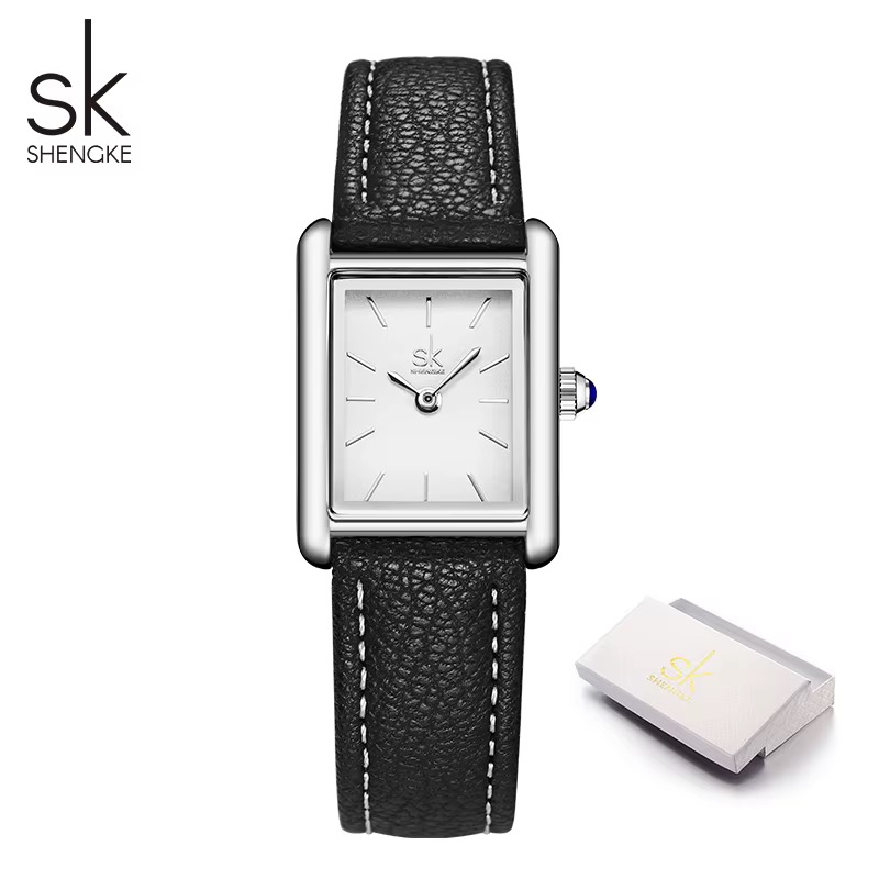 Montre SHENGKE rectangulaire femme, cadran blanc, bracelet noir surpiqué, couronne à cabochon bleu
