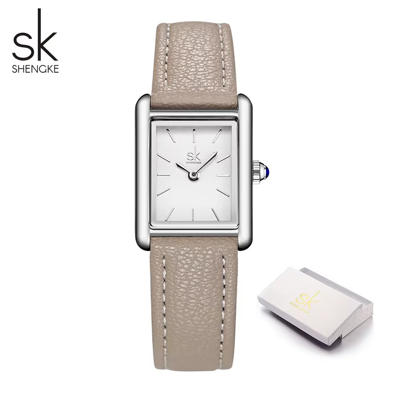 Montre SHENGKE rectangulaire femme, cadran blanc, bracelet taupe surpiqué, couronne à cabochon bleu
