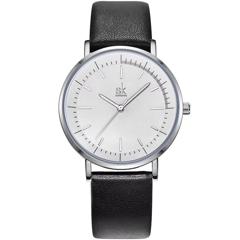 Montre SHENGKE minimaliste ronde, boîtier argenté, cadran blanc épuré, bracelet noir