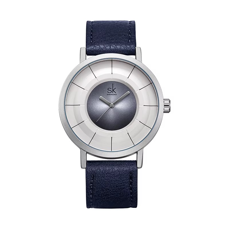 Montre SHENGKE au cadran en relief à plusieurs niveaux, boîtier argenté, cadran blanc et bleu, bracelet bleu marine