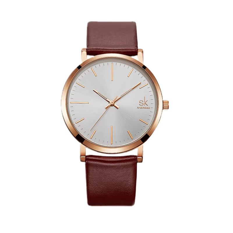Montre SHENGKE classique, boîtier fin ton or rose, cadran blanc soleillé, bracelet marron