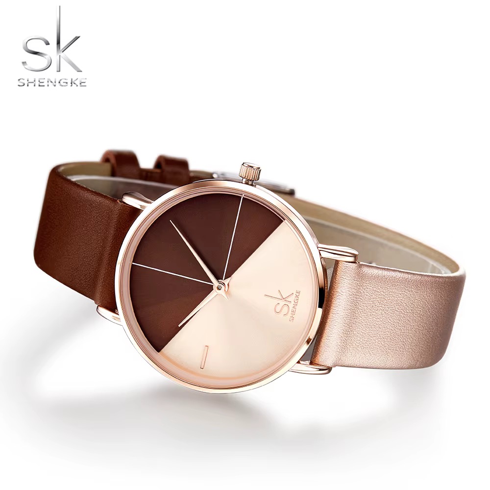 Montre femme SHENGKE, boîtier ton or rose, cadran bicolore chocolat et rosé, bracelet bicolore marron