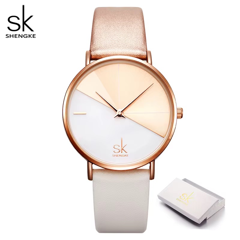 Montre femme SHENGKE, boîtier ton or rose, cadran bicolore blanc et rosé, bracelet blanc