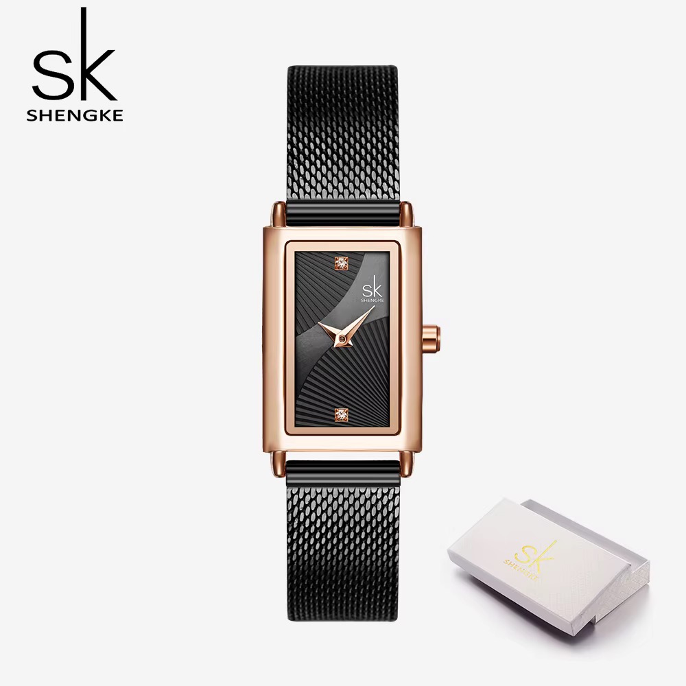 Montre femme SHENGKE rectangulaire, boîtier ton or rose, cadran noir à motif rayonnant, bracelet maille noire